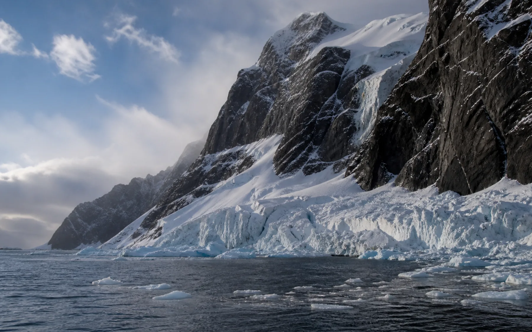 Glacier-cut cliffs and brash ice at Point Wild, Elephant Island