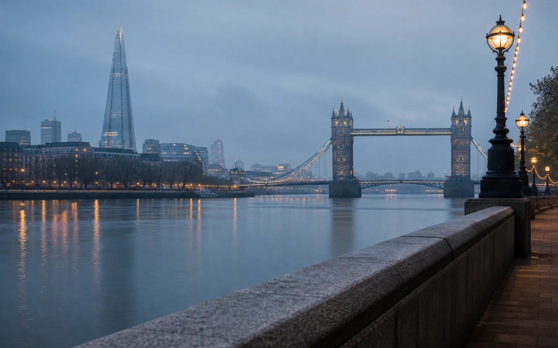 Tower Bridge and the River Thames in quiet grey-blue dawn light
